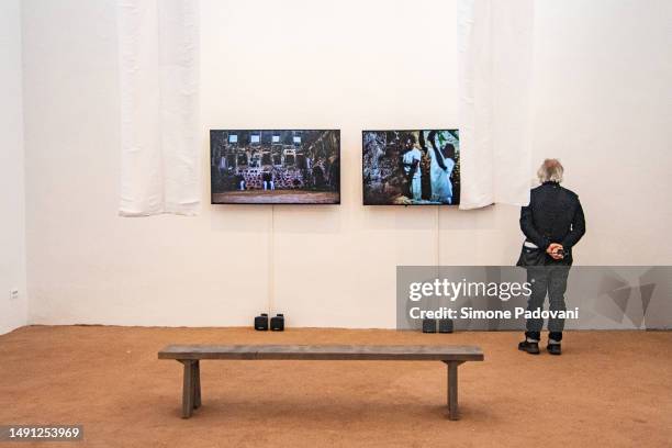 Visitors attend the press preview at the Brazilian pavilion "Terra [Earth]" curated by Gabriela de Matos e Paulo Tavares and with the exhibitors Ana...