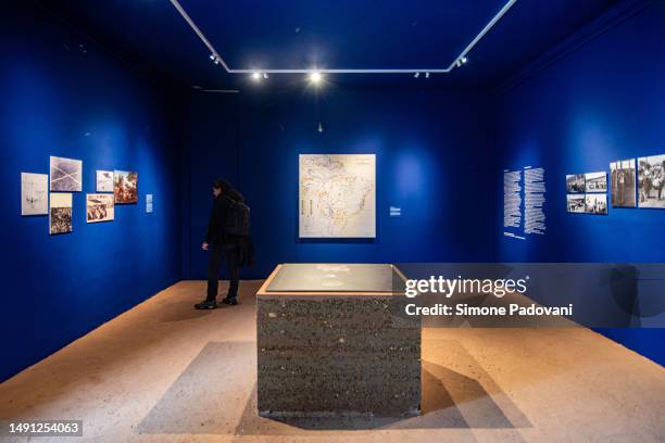 Visitors attend the press preview at the Brazilian pavilion "Terra [Earth]" curated by Gabriela de Matos e Paulo Tavares and with the exhibitors Ana...