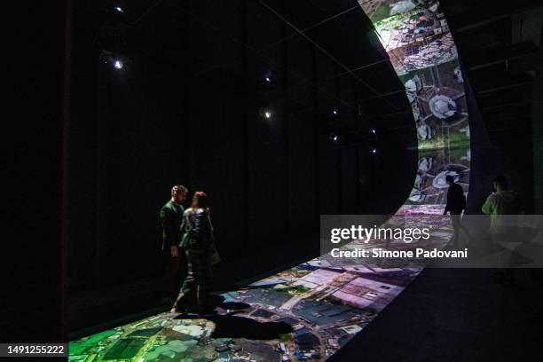 Visitors attend the press preview at the Serbian pavilion "IN REFLECTIONS 6°27’48.81”N 3°14’49.20”E" curated by Biljana Jotić , Dubravka Đukanović,...