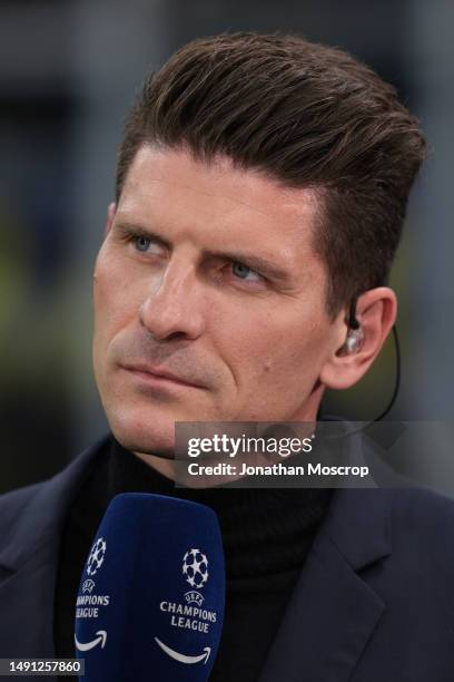 Former footballer Mario Gomez reacts as he comments at a touchline TV position prior to the UEFA Champions League semi-final second leg match between...