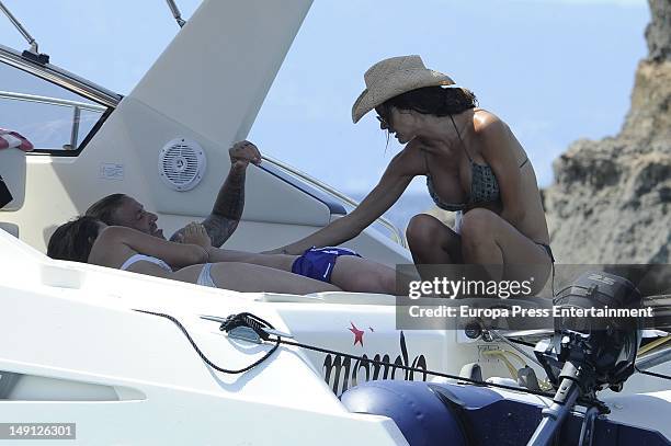 Spanish footballplayer Guti and his girlfriend Romina Belluscio, several months pregnant, are seen on a yacht on July 21, 2012 in Ibiza, Spain.