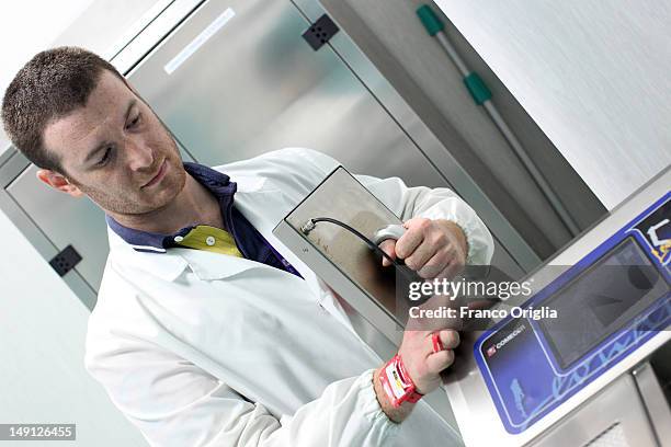 An employee works at the NSA radiopharmaceutical plant on July 08, 2011 in Aedea Rome, Italy. Nuclear Specialists Associated, Radiopharmacy,...