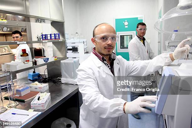 Employees work at the NSA radiopharmaceutical plant on July 08, 2011 in Aedea Rome, Italy. Nuclear Specialists Associated, Radiopharmacy,...