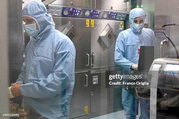 Employees work at the NSA radiopharmaceutical plant on July 08, 2011 in Aedea Rome, Italy. Nuclear Specialists Associated, Radiopharmacy,...