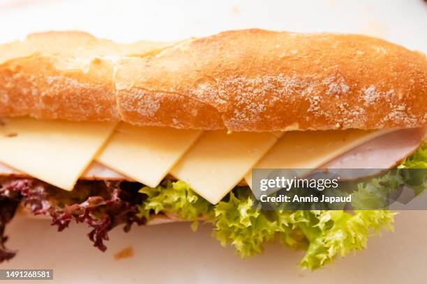 freshly made baguette sandwich with ham and cheese, top view, selective focus, food background - wallpaper roll stockfoto's en -beelden