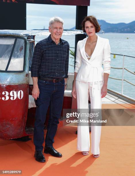 Harrison Ford and Phoebe Waller-Bridge attend "Indiana Jones And The Dial Of Destiny" photocall at Carlton Pier on May 18, 2023 in Cannes, France.