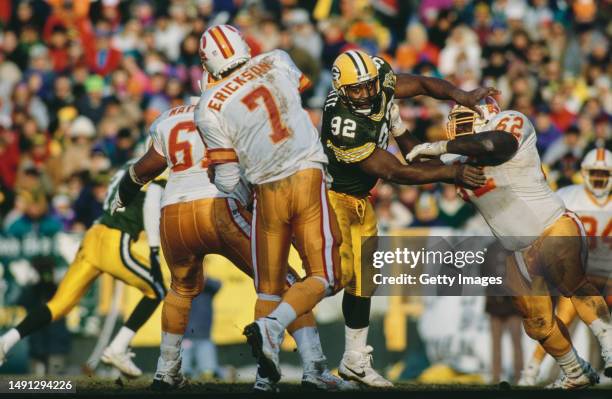 Reggie White, Defensive Tackle and Defensive End for the Green Bay Packers attempts to rush sack Craig Erickson, Quarterback for the Tampa Bay...