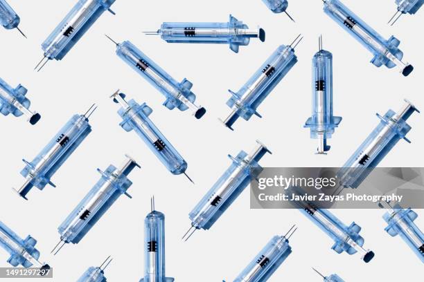 some syringes on white background - steroids stock pictures, royalty-free photos & images