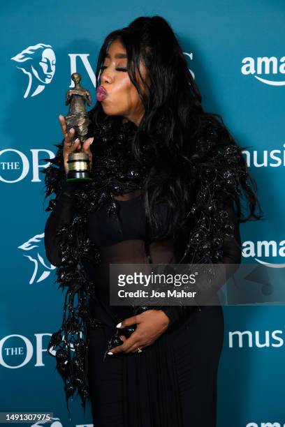 Kamille poses with the award after winning Outstanding Song Collection at The Ivors 2023 at Grosvenor House on May 18, 2023 in London, England.