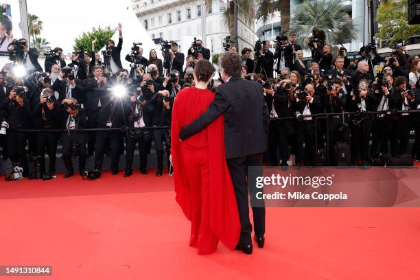Gong Li and Jean-Michel Jarre attend the "Indiana Jones And The Dial Of Destiny" red carpet during the 76th annual Cannes film festival at Palais des...