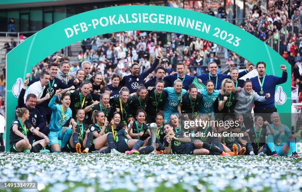 Alexandra Popp of VfL Wolfsburg and team mates celebrate with the DFB Cup after winning the Women's DFB Cup Final between VfL Wolfsburg and...