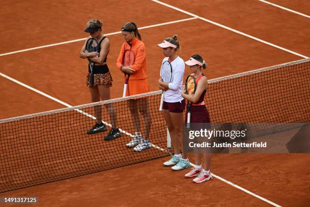 Storm Hunter of Australia, Elise Mertens of Belgium, Marie Bouzkova of Czech Republic and Bethanie Mattek-Sands of United States stand for a moment's...