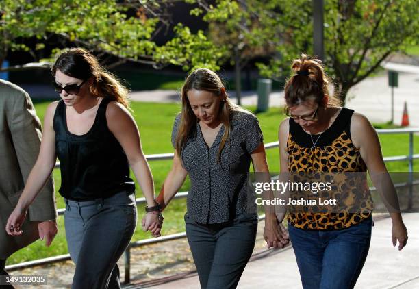 Friends and family of victims of last Friday's movie theater mass shooting arrive at the Arapahoe County Courthouse for suspect James Holmes' first...