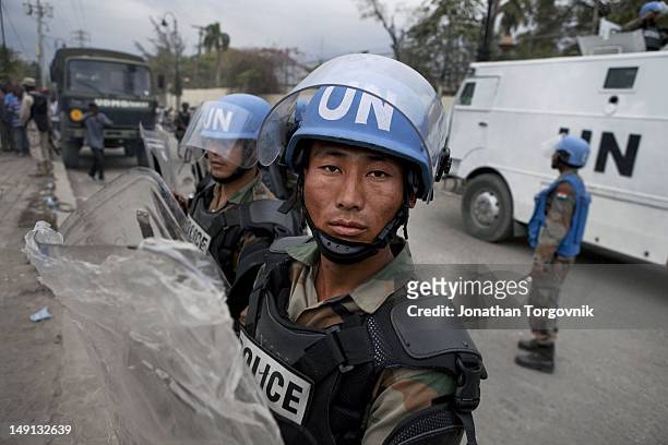 United Nations Peace Keeping Forces from India stand guard outside the Karibe hotel where Jean-Claude Duvalier, the former Haitian leader known as...