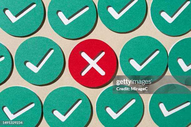 a red cross mark among green check marks paper craft - rules stock pictures, royalty-free photos & images