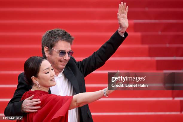 Jean-Michel Jarre and Gong Li attend the "Indiana Jones And The Dial Of Destiny" red carpet during the 76th annual Cannes film festival at Palais des...