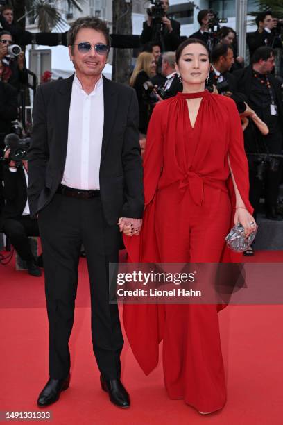 Jean-Michel Jarre and Gong Li attend the "Indiana Jones And The Dial Of Destiny" red carpet during the 76th annual Cannes film festival at Palais des...