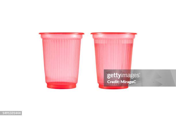 empty red plastic cup and full plastic cup of water isolated on white - disposable cup stock pictures, royalty-free photos & images
