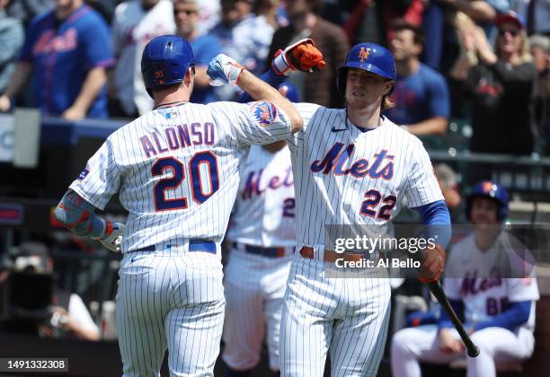 Pete Alonso of the New York Mets celebrates with Brett Baty after hitting a home run against the Tampa Bay Rays during their game at Citi Field on...