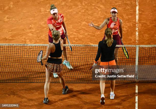 Storm Hunter of Australia and Elise Mertens of Belgium shake hands with Marie Bouzkova of Czech Republic and Bethanie Mattek-Sands of United States...