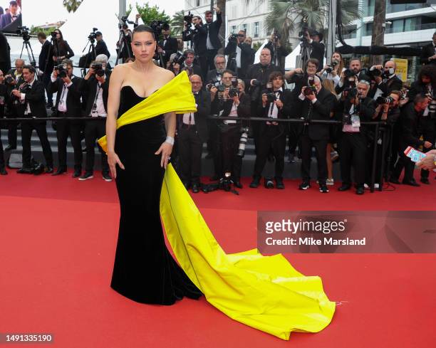 Adriana Lima attends the "Indiana Jones And The Dial Of Destiny" red carpet during the 76th annual Cannes film festival at Palais des Festivals on...