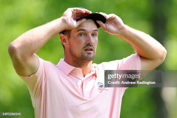 Bryson DeChambeau of the United States looks on from the fourth tee during the first round of the 2023 PGA Championship at Oak Hill Country Club on...