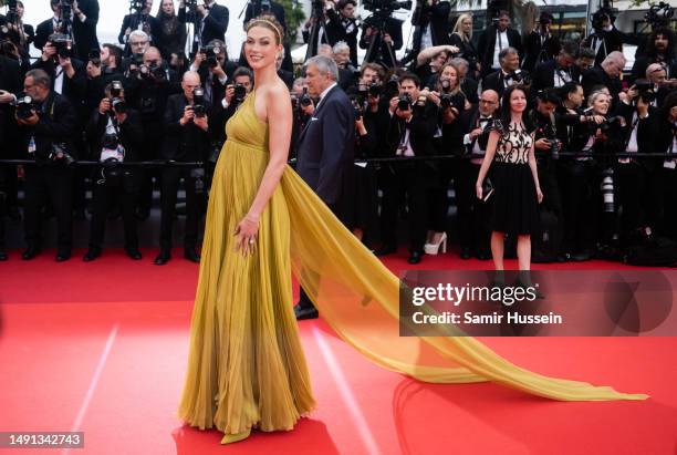 Karlie Kloss attends the "Indiana Jones And The Dial Of Destiny" red carpet during the 76th annual Cannes film festival at Palais des Festivals on...