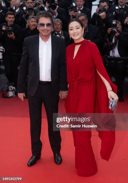 Jean-Michel Jarre and Gong Li attend the "Indiana Jones And The Dial Of Destiny" red carpet during the 76th annual Cannes film festival at Palais des...