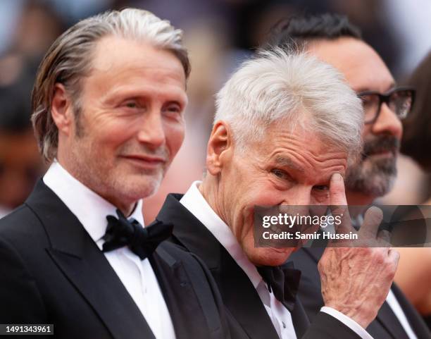 Harrison Ford and Mads Mikkelsen attend the "Indiana Jones And The Dial Of Destiny" red carpet during the 76th annual Cannes film festival at Palais...