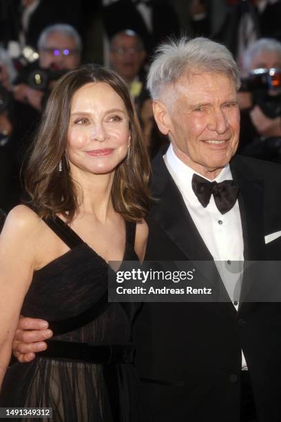 Calista Flockhart and Harrison Ford depart the "Indiana Jones And The Dial Of Destiny" red carpet during the 76th annual Cannes film festival at...