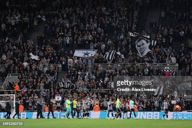 Fans of Newcastle United celebrate victory with their players after the Premier League match between Newcastle United and Brighton & Hove Albion at...