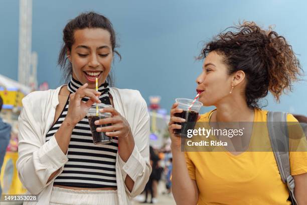 friends in the amusement park - cold drink stock pictures, royalty-free photos & images