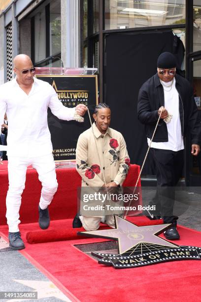 Vin Diesel, Ludacris, and LL Cool J attend a ceremony honoring Ludacris with a star on the Hollywood Walk of Fame on May 18, 2023 in Hollywood,...