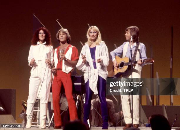 English/Australian singer and songwriter Andy Gibb performs with Swedish singers and songwriters Anni-Frid Lyngstad, Agnetha Fältskog and Björn...