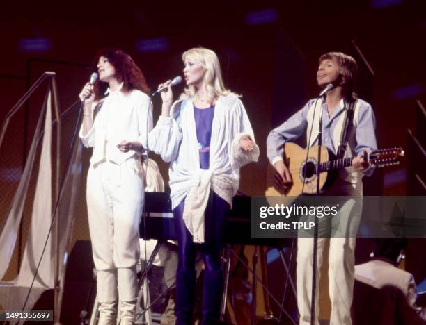 Swedish singers and songwriters Anni-Frid Lyngstad, Agnetha Fältskog and Björn Ulvaeus, of the supergroup ABBA, perform on stage during the Olivia!...