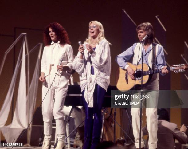 Swedish singers and songwriters Anni-Frid Lyngstad, Agnetha Fältskog and Björn Ulvaeus, of the supergroup ABBA, perform on stage during the Olivia!...