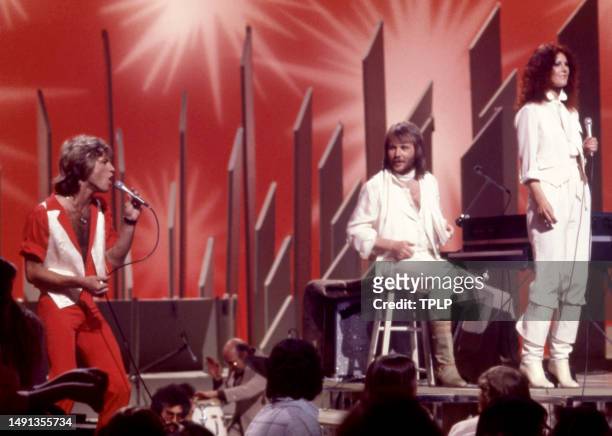 English/Australian singer and songwriter Andy Gibb and Swedish singers and songwriters Benny Andersson and Anni-Frid Lyngstad, of the supergroup...