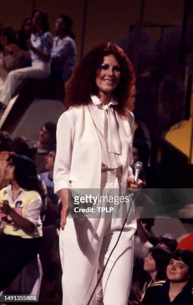 Swedish singer and songwriter Anni-Frid Lyngstad, of the supergroup ABBA, perform on stage during the Olivia! TV Special at The Columbia Studios in...