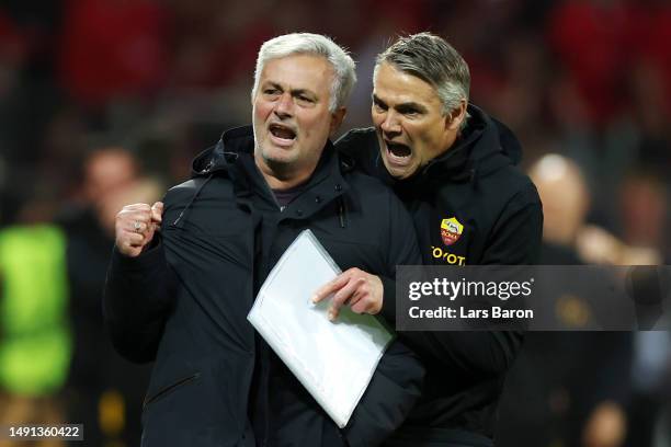 Jose Mourinho, Head Coach of AS Roma, celebrates victory alongside a member of support staff after the UEFA Europa League semi-final second leg match...