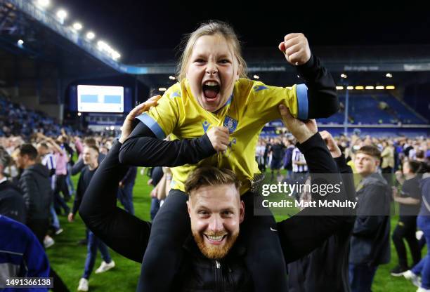 Sheffield Wednesday fans celebrate on the pitch after seeing their team win a penalty shoot-out following the Sky Bet League One Play-Off Semi-Final...