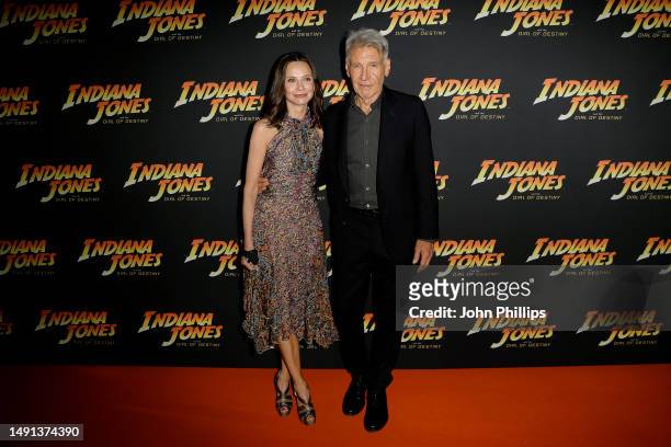 Calista Flockhart and Harrison Ford attend "Indiana Jones and The Dial Of Destiny" party at Carlton Beach on May 18, 2023 in Cannes, France.