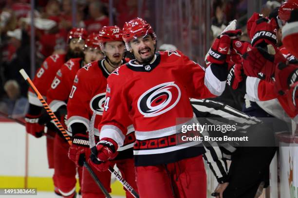 Seth Jarvis of the Carolina Hurricanes celebrates with his teammates after scoring a goal on Sergei Bobrovsky of the Florida Panthers during the...