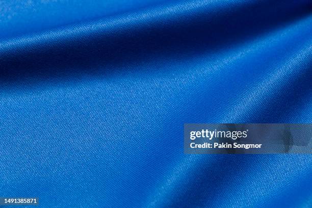 blue color sports clothing fabric football shirt jersey texture and textile background - jersey soccer foto e immagini stock