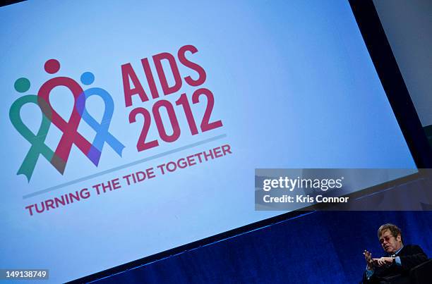 Sir Elton John speaks during a panel discussion at the 19th International AIDS Conference at The Walter E. Washington Convention Center on July 23,...