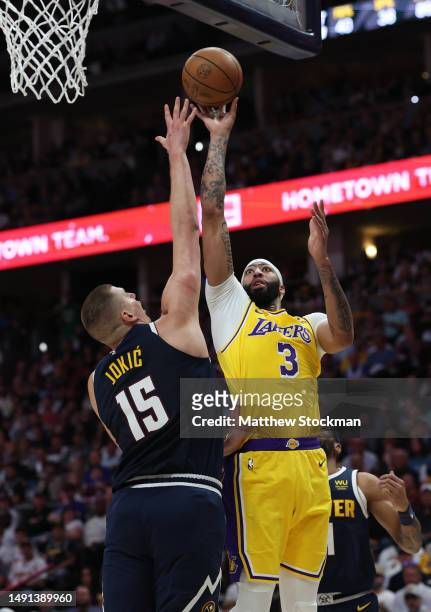 Anthony Davis of the Los Angeles Lakers shoots over Nikola Jokic of the Denver Nuggets during the first quarter in game two of the Western Conference...