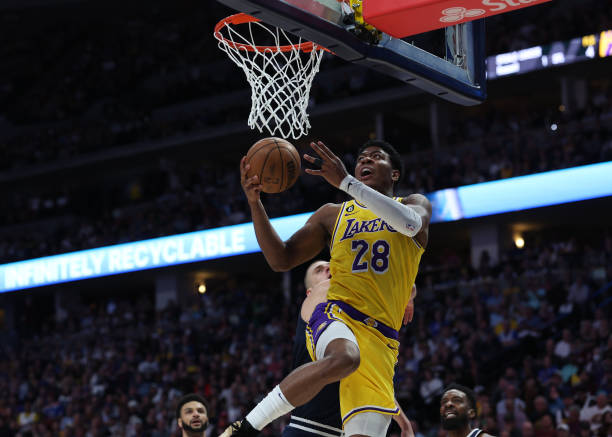 Rui Hachimura of the Los Angeles Lakers drives to the basket against Nikola Jokic of the Denver Nuggets during the first quarter in game two of the...