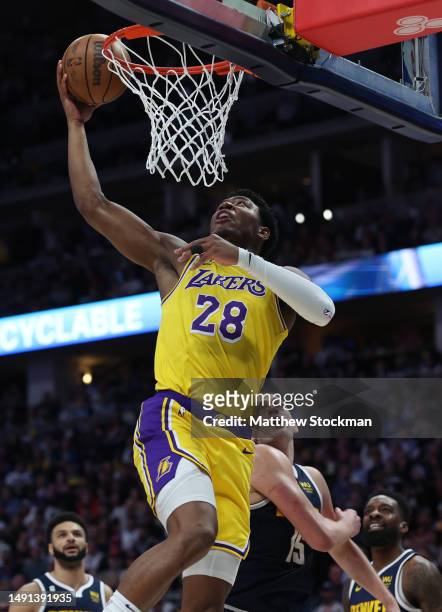 Rui Hachimura of the Los Angeles Lakers drives to the basket against Nikola Jokic of the Denver Nuggets during the first quarter in game two of the...