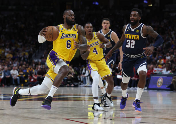 LeBron James of the Los Angeles Lakers drives to the basket against Jeff Green of the Denver Nuggets during the second quarter in game two of the...