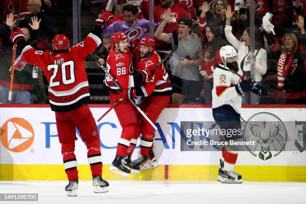 Stefan Noesen of the Carolina Hurricanes celebrates with teammates Martin Necas and Sebastian Aho after scoring a goal on Sergei Bobrovsky of the...