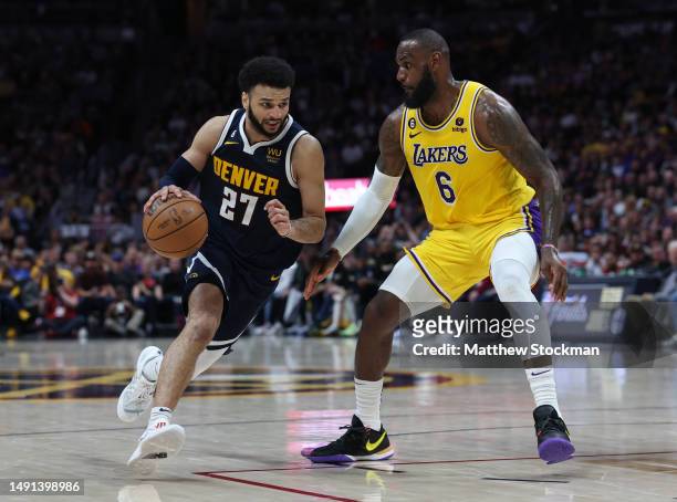Jamal Murray of the Denver Nuggets drives against LeBron James of the Los Angeles Lakers during the third quarter in game two of the Western...